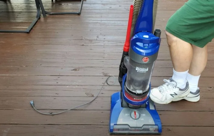 step on a pedal to wind the cord